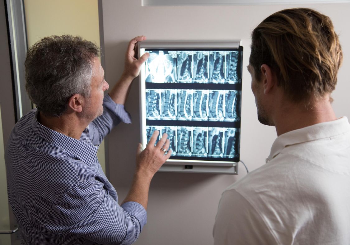 bay chiropractic new patient being shown xray image